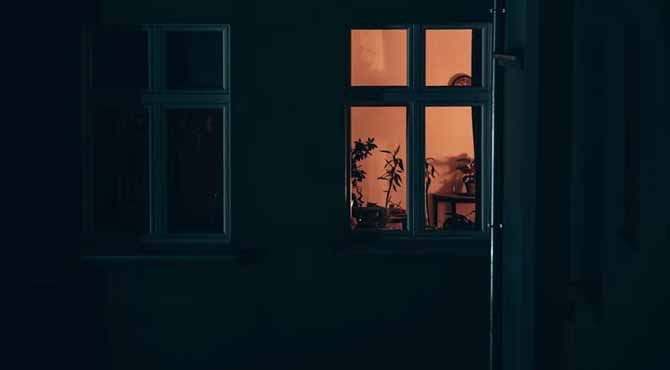 My MIL Moved in with Us — I Found Her Showing a Strange Sign In the Window Every Night